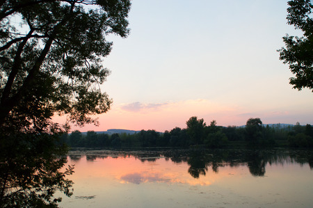 Reflection on the lake after sunsetの写真素材