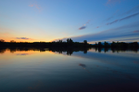 Reflection on the lake after sunsetの写真素材