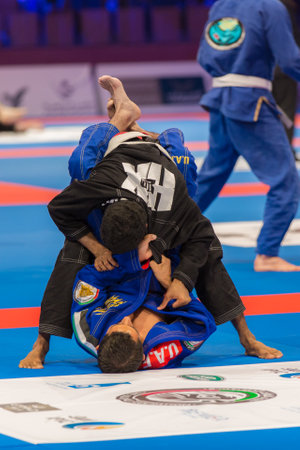ABU DHABI, UAE - APRIL 19, 2016: ABU DHABI WORLD PROFESSIONAL JIU-JITSU CHAMPIONSHIP 2016 in the IPIC ARENA. Fighters on the mat.のeditorial素材
