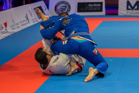 ABU DHABI, UAE - APRIL 19, 2016: ABU DHABI WORLD PROFESSIONAL JIU-JITSU CHAMPIONSHIP 2016 in the IPIC ARENA. Fighters fighting in parterre.のeditorial素材