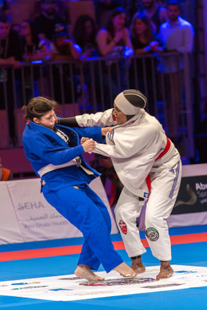 ABU DHABI, UAE - APRIL 19, 2016: ABU DHABI WORLD PROFESSIONAL JIU-JITSU CHAMPIONSHIP 2016 in the IPIC ARENA. Fighters female fighting.のeditorial素材