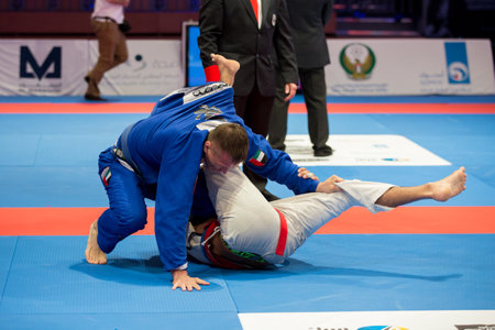 ABU DHABI, UAE - APRIL 19, 2016: ABU DHABI WORLD PROFESSIONAL JIU-JITSU CHAMPIONSHIP 2016 in the IPIC ARENA. Fighters fighting in parterre.のeditorial素材