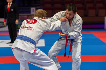 ABU DHABI, UAE - APRIL 19, 2016: ABU DHABI WORLD PROFESSIONAL JIU-JITSU CHAMPIONSHIP 2016 in the IPIC ARENA. Fighters with blue belts fighting.のeditorial素材