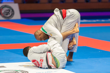 ABU DHABI, UAE - APRIL 19, 2016: ABU DHABI WORLD PROFESSIONAL JIU-JITSU CHAMPIONSHIP 2016 in the IPIC ARENA. Male fighters black belts in the parterre.のeditorial素材