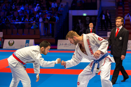 ABU DHABI, UAE - APRIL 19, 2016: ABU DHABI WORLD PROFESSIONAL JIU-JITSU CHAMPIONSHIP 2016 in the IPIC ARENA. Men fighters greeting each other.のeditorial素材