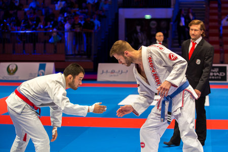 ABU DHABI, UAE - APRIL 19, 2016: ABU DHABI WORLD PROFESSIONAL JIU-JITSU CHAMPIONSHIP 2016 in the IPIC ARENA. Fighters starting the fight.のeditorial素材