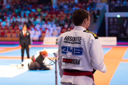 ABU DHABI, UAE - APRIL 19, 2016: ABU DHABI WORLD PROFESSIONAL JIU-JITSU CHAMPIONSHIP 2016 in the IPIC ARENA. Fighter in white kimono ready to fight.のeditorial素材