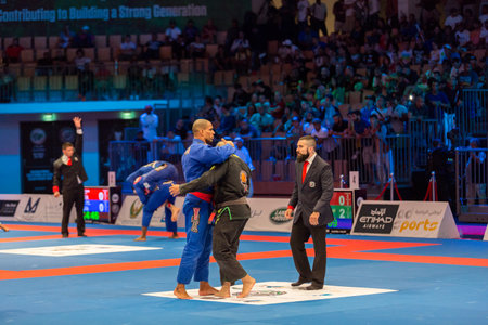 ABU DHABI, UAE - APRIL 19, 2016: ABU DHABI WORLD PROFESSIONAL JIU-JITSU CHAMPIONSHIP 2016 in the IPIC ARENA. Fighters hugging each other.のeditorial素材