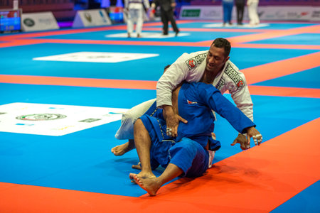 ABU DHABI, UAE - APRIL 19, 2016: ABU DHABI WORLD PROFESSIONAL JIU-JITSU CHAMPIONSHIP 2016 in the IPIC ARENA. Fighters fight in parterre.のeditorial素材