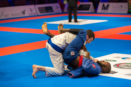 ABU DHABI, UAE - APRIL 19, 2016: ABU DHABI WORLD PROFESSIONAL JIU-JITSU CHAMPIONSHIP 2016 in the IPIC ARENA. Fighters on the mat.のeditorial素材