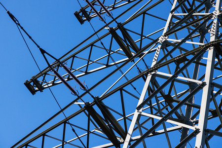 Metal power line structures with wires. Close-up of part of the support.の写真素材