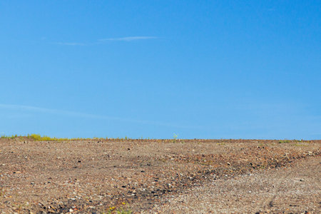 Bare Earth and Blue Sky. Nobody on the picture.