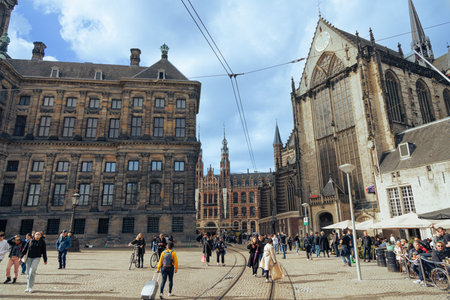 Amsterdam - 02 October 2022 - People on the Dam central square in the old town of Amsterdam city near the Nieuwe Kerk church.のeditorial素材