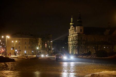 Car traffic near Church Church of Saint Bernardine of Siena in winter at night.の写真素材