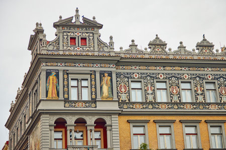 Beautifully decorated building in Prague. We see frescoes, ornaments and a religious theme.の写真素材