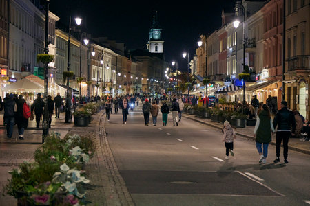 Walking popular pedestrian street in Warsaw at night, Poland.のeditorial素材