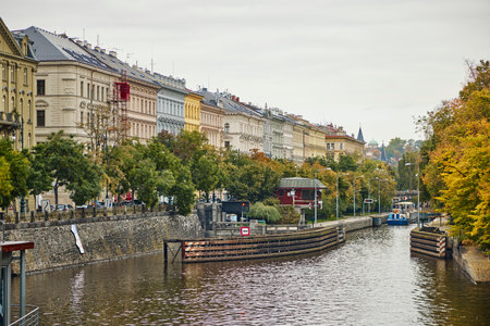Historic buildings on the banks of the water canal in Prague in autumn.の写真素材