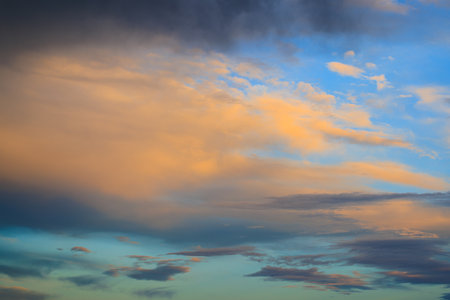 Twilight orange and blue sky and clouds at sunsetの写真素材