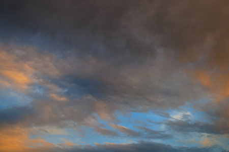 Twilight sky and gentle clouds at sunset background.の写真素材