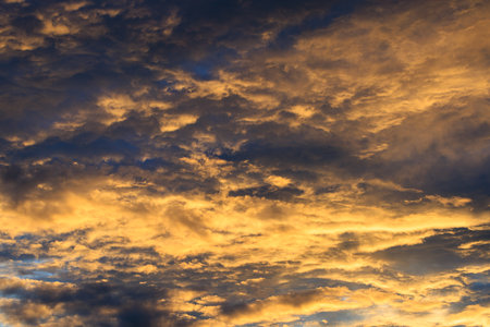 Orange and yellow sky clouds in the eveningの写真素材