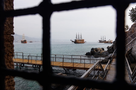 View through the bars of old pirate ships.の写真素材