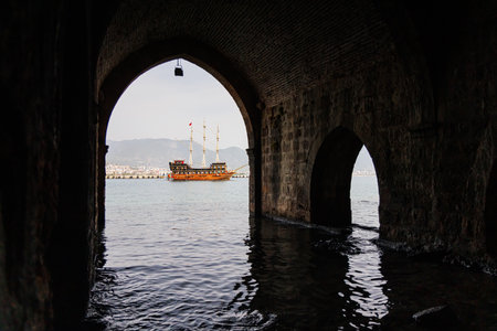 Inside the old shipyard of Alanya, Turkey. In the background there is an old pirate ship.の写真素材