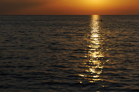Sea waves at sunset with pathwayの写真素材