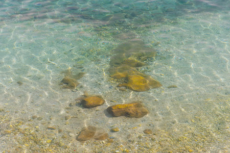 Stones in calm sea water.の写真素材