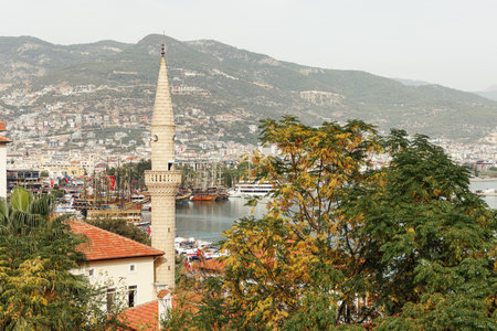 Minaret among houses in Alanya city.の写真素材