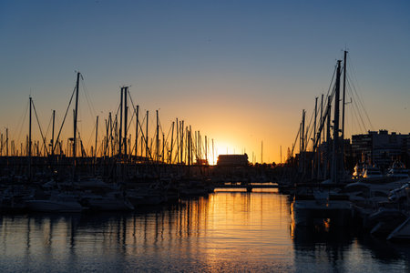 Sunset at the yacht marina with silhouette in Alicante, Spain.の写真素材