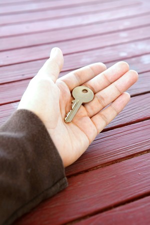 Single key in palm. Concept of opportunity and independanceの写真素材