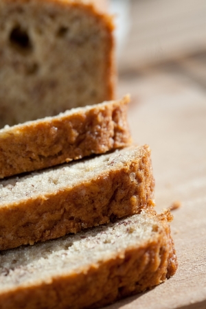 Delicious freshly baked banana bread on wooden boardの写真素材