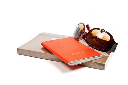 Journal, passport and sunglasses on white.の写真素材