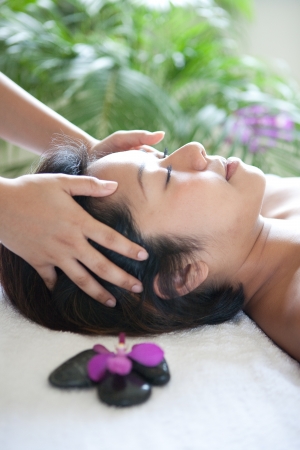 Young woman enjoying a massage day at the spaの写真素材