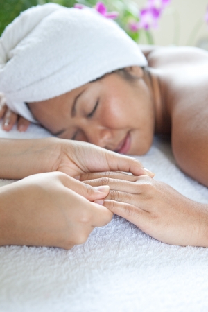 Young woman enjoying a massage day at the spaの写真素材