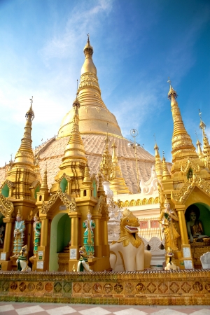 Central pagoda surrounded by hundreds of smaller shrines of Shwedagon pagoda, Yangon, Myanmar の写真素材