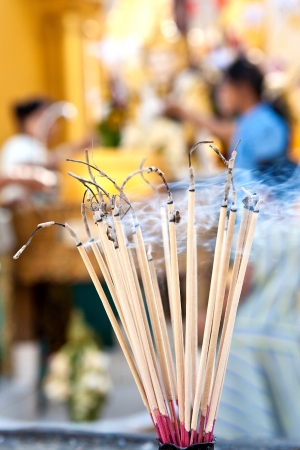 Stack of praying joss stick burns in the compound of a buddhist temple for devoteesの写真素材