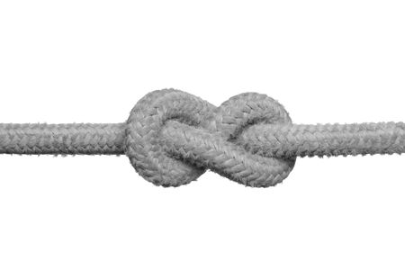 Tight knot on the rope (concept of unsolved problem) isolated on the white background.の写真素材