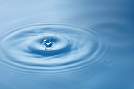 A drop falling into the water.