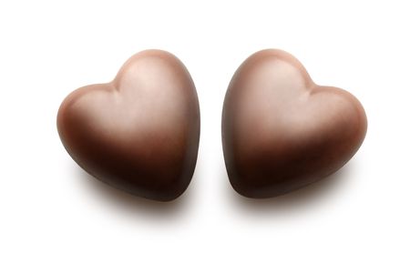 Two chocolate hearts isolated on the white background.の写真素材