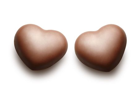 Two chocolate hearts isolated on the white background.の写真素材