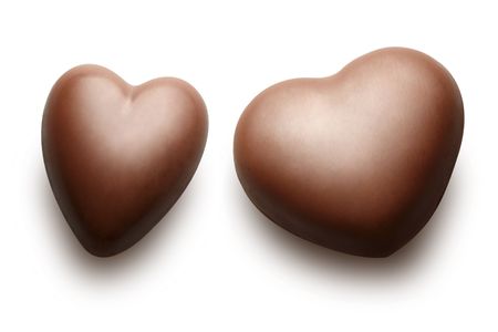 Two chocolate hearts isolated on the white background.の写真素材