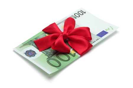 One hundred euro banknote with red bow, isolated on the white background, clipping path included.の写真素材