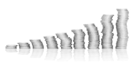 Unstable position of coins, isolated on the white background.の写真素材