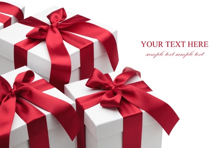 Gift boxes with red ribbons and bows isolated on the white background, clipping path included.の写真素材