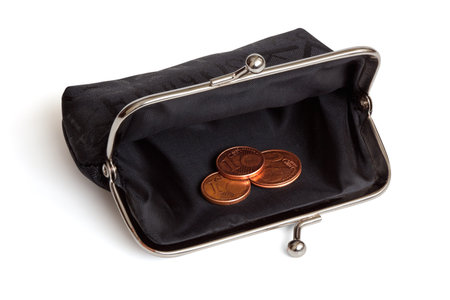 Black purse and several euro cent coins, isolated on the white background