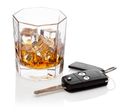 Glass of whiskey and car keys, isolated on the white background, clipping path included の写真素材
