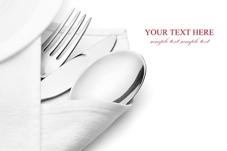 Knife, fork and spoon with linen serviette, isolated on the white background, clipping path included の写真素材