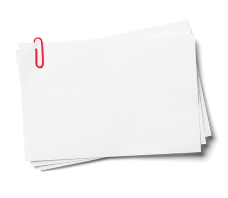 White note papers with red clip, isolated on the white background, clipping path included の写真素材