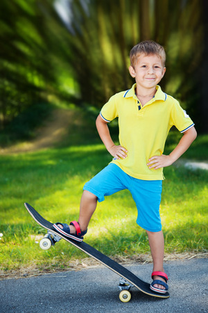Little boy enjoying skateboarding in the park  の写真素材